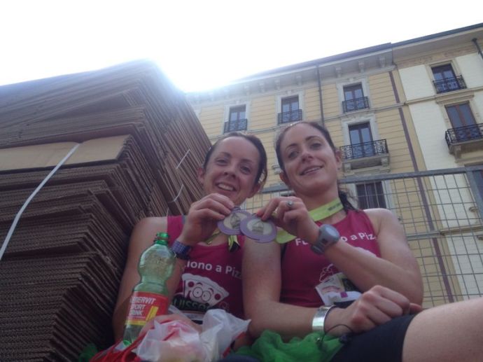 Across the finish line, Rachel finds only place of shade. An old cardboard box. We stay there for 30 mins to cool down